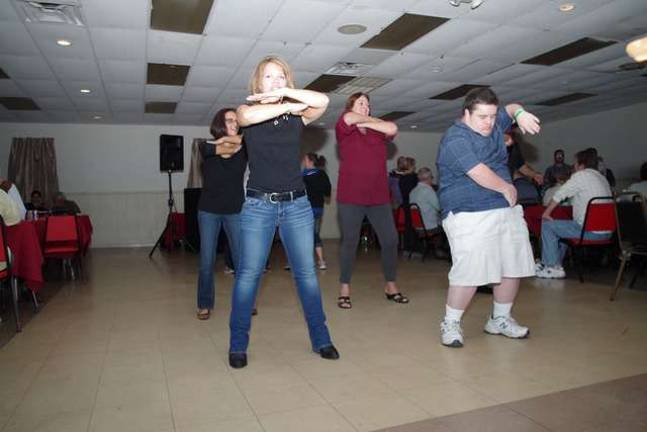 Photos by Chris Wyman Attendees hit the dance floor.