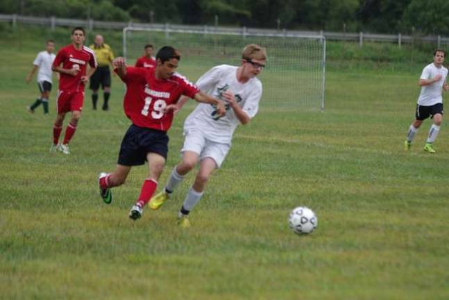 A Manchester Falcon and Sussex County Tech Mustang battle for the ball during a scrimmage.