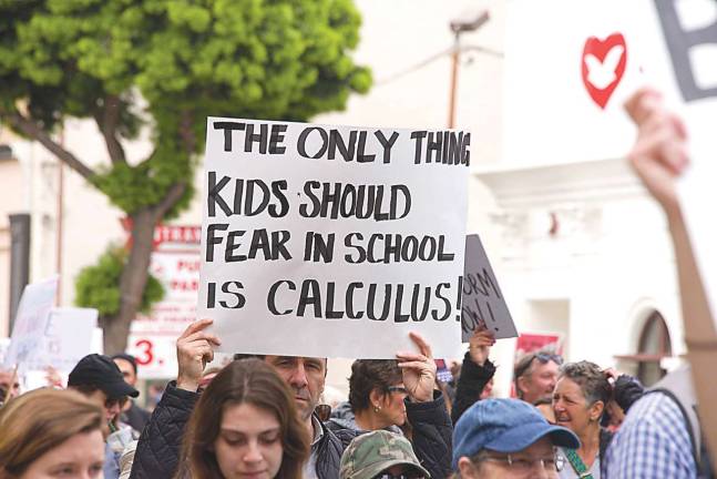 Los Angeles, CA - March 24, 2018: With calls to End gun violence, no more silence! thousands of students and adults march to protest gun violence. March for our lives.