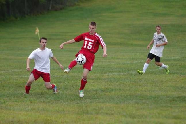 Sussex County Tech Mustangs shadow a Manchester Regional High School athlete Valentino Tusha during a scrimmage.