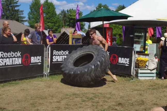 A competitor tries the tire flip.