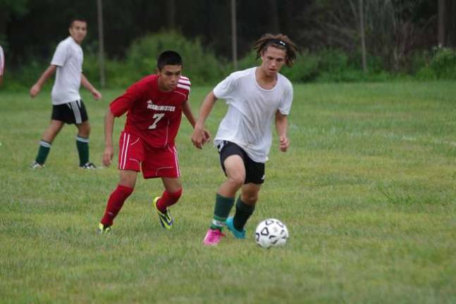 Sussex County Tech senior and soccer team captain Adam Taylor driving the ball during a scrimmage.