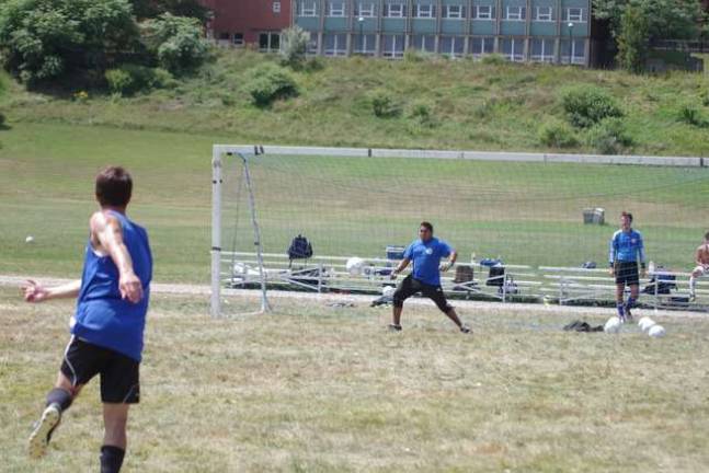 Skylanders assistant coach Auggie Casas plays goalie as the ball moves towards him. Casas is from Peru.