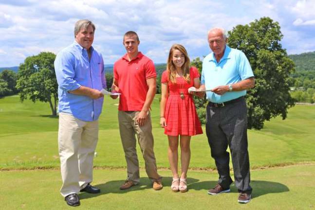 Photo credit Lauren Scrudato/Crystal Springs Resort Recipients of the Gene Mulvihill Memorial Scholarship, William VanDyke and Christiane Lowcher, receive their awarded checks from owner of Crystal Springs Resort, Andrew Mulvihill, left, and chairman of the U.S. Freedom Charitable Trust and lifelong friend of the Mulvihill family John Steinbach, right, on the golf greens of Crystal Springs on July 30.