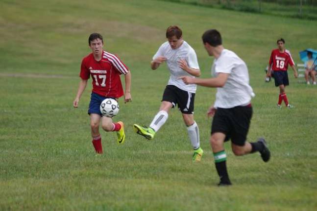 Sussex Tech Mustangs practice for season Sussex County Tech's Zach Lagrave kicks the ball during a scrimmage against Manchester Regional High School.