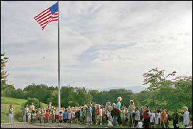 Praying at the flagpole Praying at the flagpole