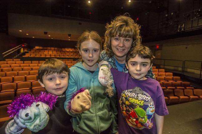 (L-R) Jason Cahill, 8, of Vernon, sister Emma, 12, mom Meg Gummere, and brother Patrick 10.