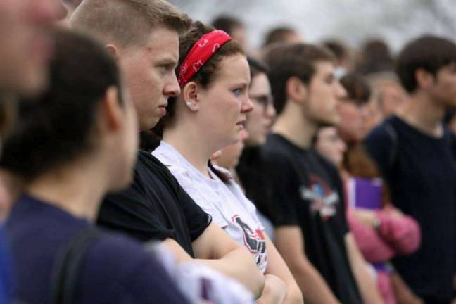 Onlooking junior Olivia DeWitt watches in horror as EMT's take Rome's 'lifeless' body away from the scene of a mock crash May 15.