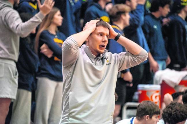 Coach Connor Healy reacts to a play.