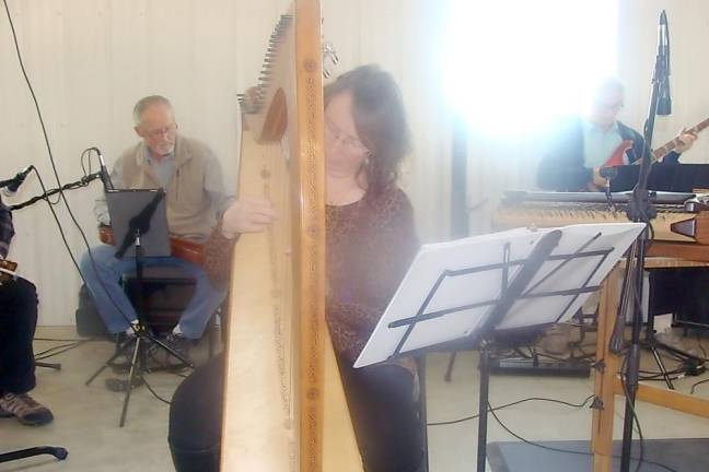 Donna Traylor plays beautiful tones on the Celtic harp.