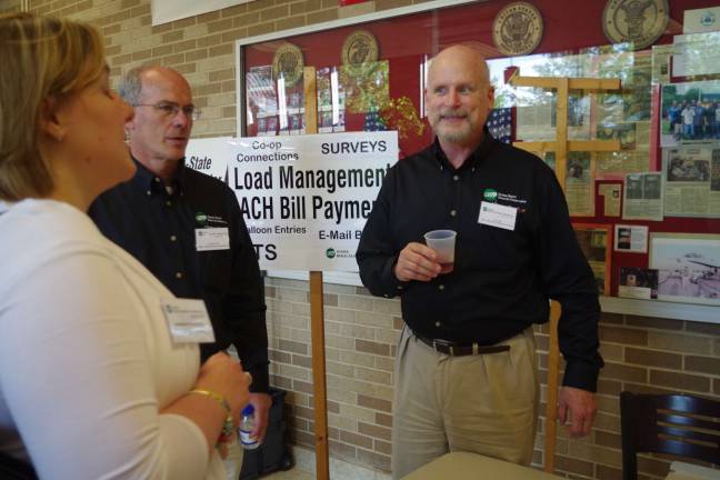 SREC holds annual meeting Tom Tate (at right), Manager of Marketing & Member Services, and Chuck Pike, manager of Engineering & Operations, were on hand to answer technical questions.