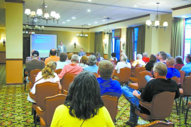 Photo by Chris Wyman Audience members listen to a proposal regarding the proposed Mountain Creek indoor waterpark.