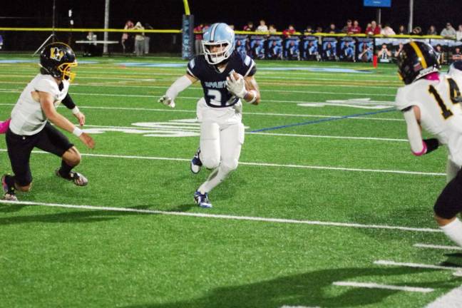 Sparta running back Josh Brancy maneuvers the ball between West Milford defenders in their game Friday, Oct. 13. Sparta won, 41-20. Brancy gained 177 yards receiving and scored three touchdowns. (Photos by George Leroy Hunter)