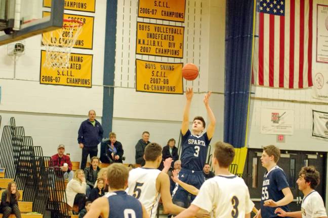 Sparta's Jack Cavanaugh lines up and shoots. Cavanaugh scored fourteen points.