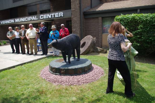 The statue was unveiled by Angi Metler, executive director of the Animal Protection League of New Jersey (left) and Beverly Budz, chairwoman of the Vernon Township Environmental Commission.