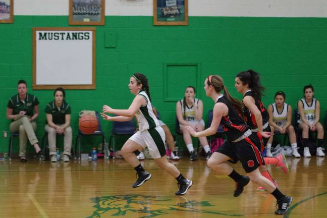 Sussex Tech's Dena Janos with the ball while being pursued by Hackettstown players.