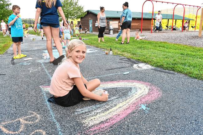 Photos: Sidewalk Chalk Art Festival in Vernon <b>Lacie Brarman of Wantage draws a rainbow.</b>