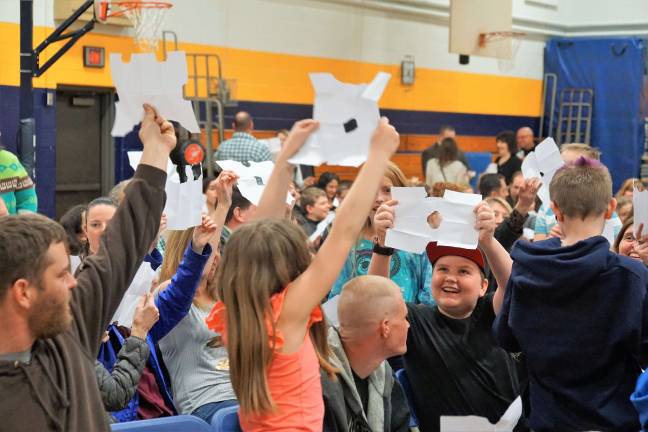 Families participate in one of the family-building activities.