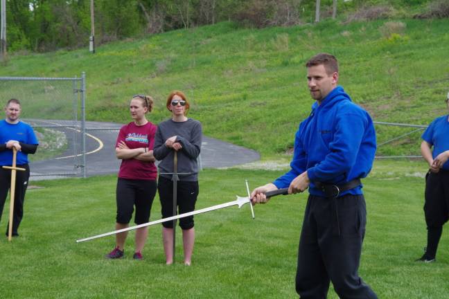 Eric White of the Glenwood section of Vernon describes the swords his group uses and how safety is an important concern when they are dueling.