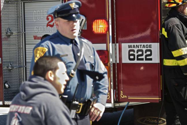 Staged fatal crash Sgt. Dan Fedge of the New Jersey State Police interviews Manuel Hanson, playing the role of the drunk driver.