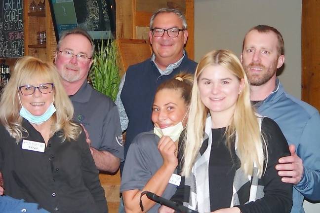 Hef’s Hut opens with golf simulator, pool table, and heated patio — and attracts locals General manager David Killin (center back) with members of the Great Gorge Golf Club staff (Photo by Dr. John T. Whiting)