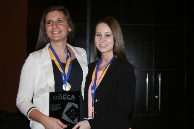 DECA competitors from VTHS head for Nationals as they topple their competition Marissa DeCaro (left) and Danielle Struble won first place in the category of Financial Literary Promotion Plan and earned a place in the National Competition next month.