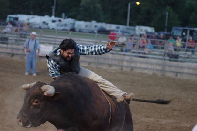 Cowboy Elmer Hernandez of Guatemala getting a rough ride on a bull.