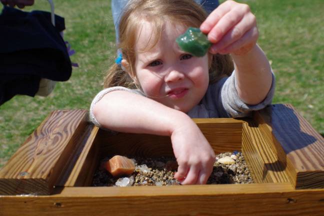 Riley DeGrezia, 3, of Barry Lakes found some rocky treasures while prospecting at the Heaven Hill Farm Mining Company.