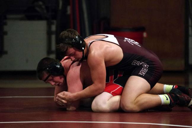 Newton's Adam Schlereth on top of High Point's Cliff Rutter in the 220 lb category. Schlereth won the match 17-0.