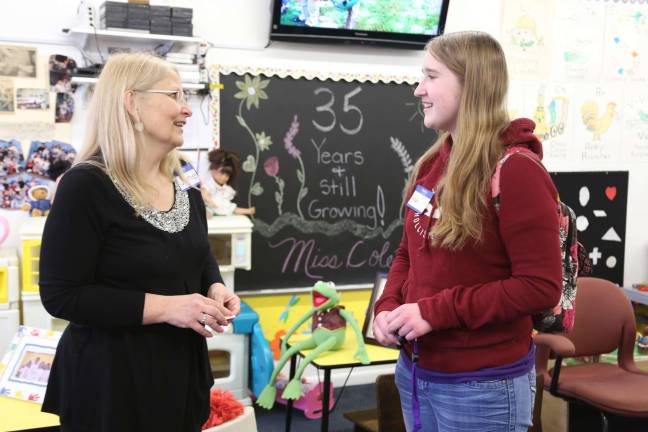 Teacher June Ruggiero talks with Sarah Fairweather of Wantage, a former student of Ruggiero's.