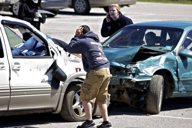 Staged fatal crash Manuel Hanson plays the role of a drunk driver in an accident as Brittany Rockenfeller calls 911.
