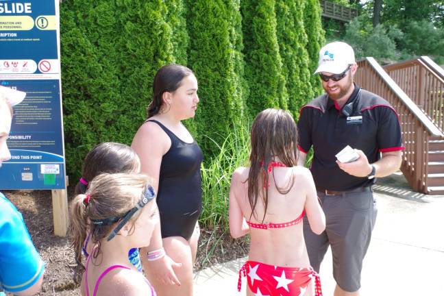 Aquatics Director Tim Stone is shown as he gave away free water park passes to the 43 participating children.