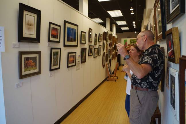 Photographer Keith Utter of Hainesville talks about his photos on display at Skylands Gallery &amp; Studio in Wantage.