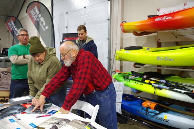 PHOTOS BY CHRIS WYMAN Neal De Graaff of Neal&#x2019;s Sports Emporium on Route 23 in Wantage brought a selection of kayaks to the show. The emporium sells kayaks, canoes, rowboats, cross-country skis and boots, snowshoes, and suitable outdoor clothing.