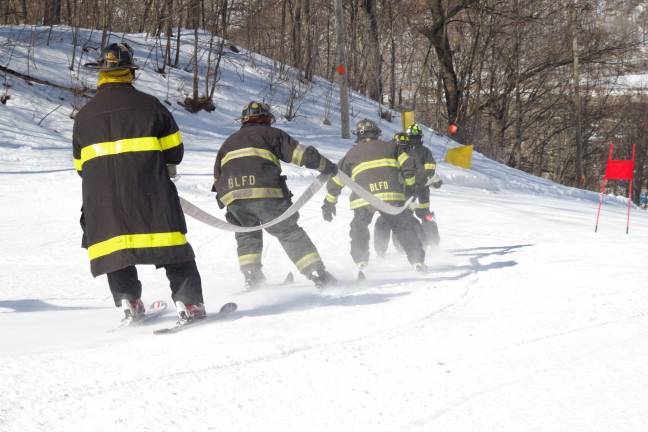 Firefighters’ race down slopes at Mountain Creek Skiing down the slopes.