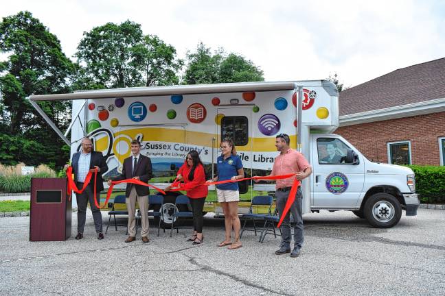 New mobile library launched From left are Will Porter, director of the Sussex County Library System; Sussex County Commissioner Jack DeGroot, state Assemblywoman Dawn Fantasia; Jill Space, deputy director of the commissioners board; and Chris Carney, director of the board, at a ceremony to launch Dot, the new mobile library, on Wednesday, June 18 outside the Sussex-Wantage branch.