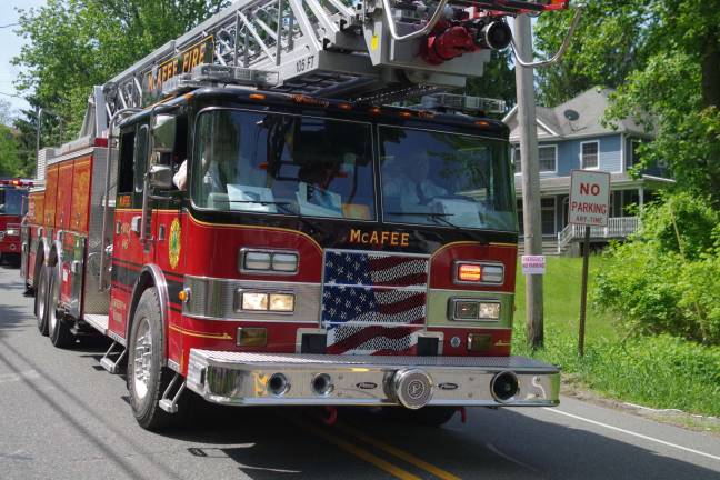 One of the McAfee Fire Department&#x2019;s fire engines being driven by department member Bud Braitsch.