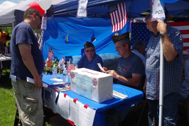 Hoping to collect enough donations to stay at its current location, the Wallkill Valley VFW Memorial Post 8441 tent was manned by Navy veterans Joe Doll and Bob Constantine and Korean War army veteran Tom Gundlach.
