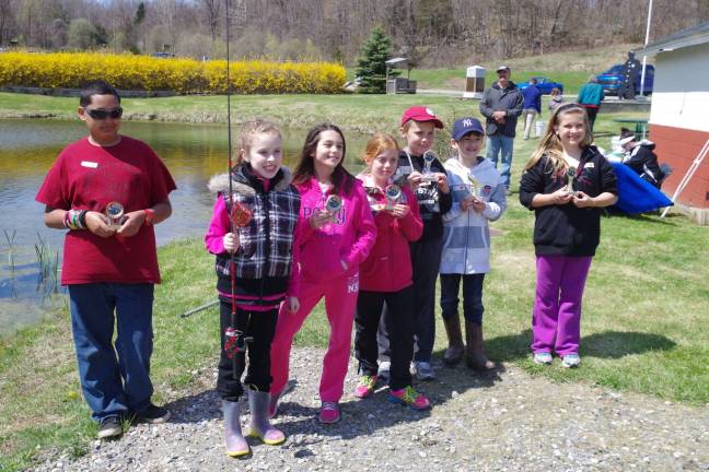 Winners in the Grades 3-6 division show off their trophies and prizes. Prizes for this year&#x2019;s event were donated by the new Mountain Mike&#x2019;s Sport Shop located on Old Rudetown Road in McAfee and 100 trout once again donated by Vernon&#x2019;s Double &#x201c;V&#x201d; Rod &amp; Gun Club.