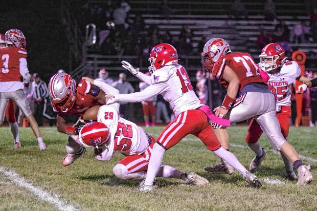 Wildcats claw Patriots, 35-6 <b>FB1 High Point ball carrier A.J. Sampson is tackled by Lenape Valley defender Chase Grant (52) in the first half of their game Friday, Oct. 10 in Hamburg. The Wildcats won, 35-6. (Photo by George Leroy Hunter)</b>
