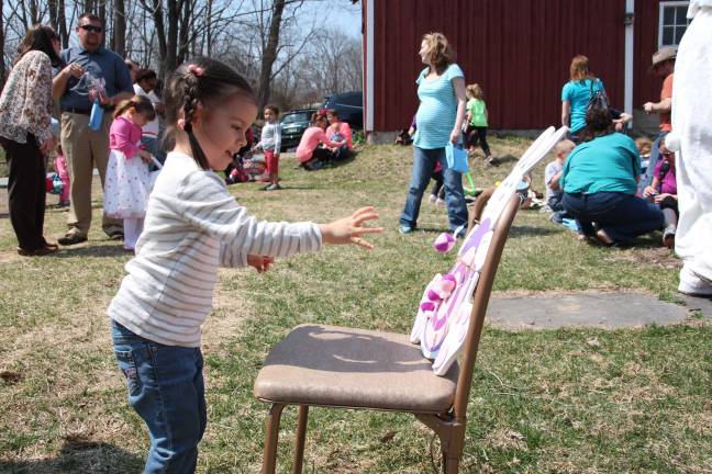DAR hosts Easter egg hunt Stacy Wilckens of Wantage tosses the ball in an Easter game.