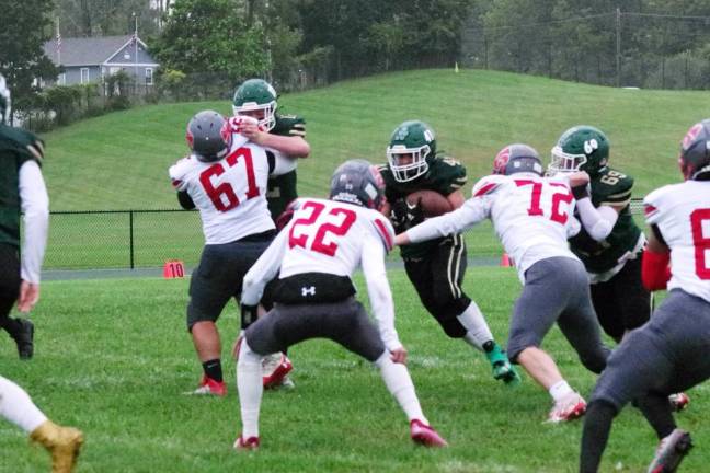 Newton leads division Sussex Tech ball carrier Samuel Fara attempts to break through the High Point defensive line.