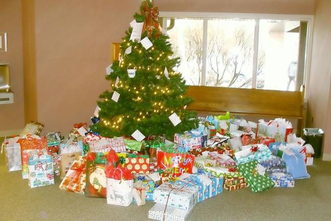 The Giving Tree at St. Francis de Sales Church beautifully displays the donation of gifts to area families in need.