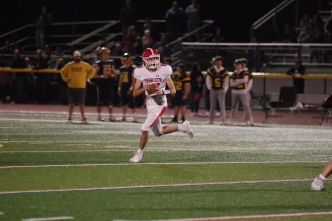 Newton leads division Lenape Valley quarterback Keith Wagner on the move in the second half.