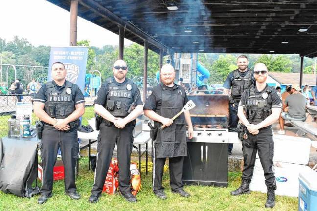 Photos: National Night Out in Sussex County Police officers man the grill during the National Night Out event Tuesday, Aug. 5 in Franklin.