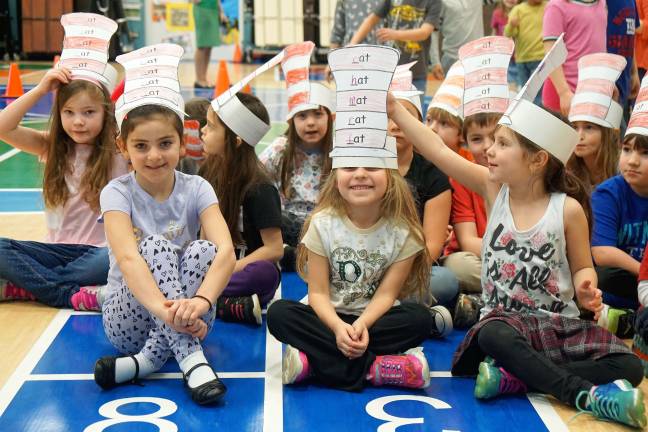 Walnut Ridge students model their hats.