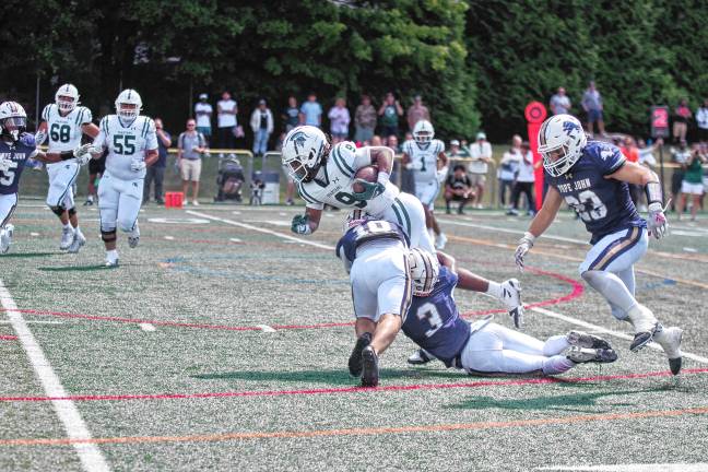 Football roundup: High Point beats Jefferson <b>PJ3 Pope John defenders tackle a DePaul ball carrier. (Photo by George Leroy Hunter)</b>