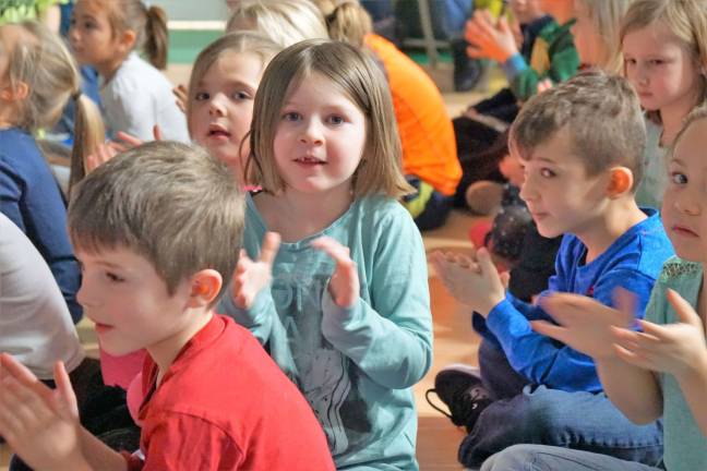 Walnut Ridge children clap for the first-graders.