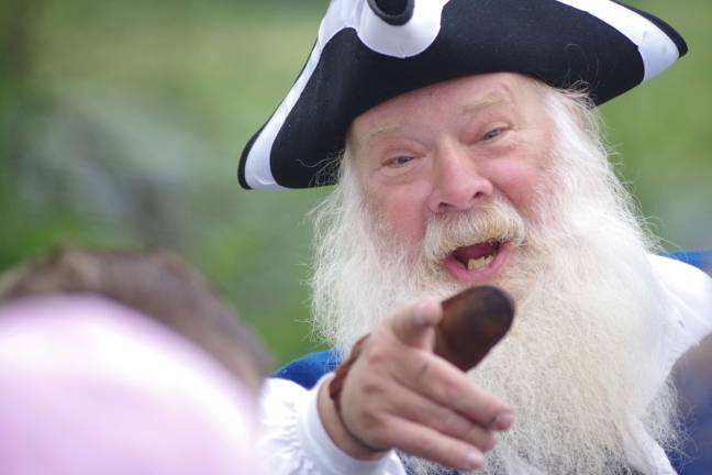 Wearing a black and white three-cornered hat, a very animated Chester Davis of Manalapan was in charge of teaching the children about the five-pound cannon and the steps necessary to safely fire the gun.Not surprisingly, during the Christmas holidays he also has been known to play the part of Jolly Old Saint Nick.