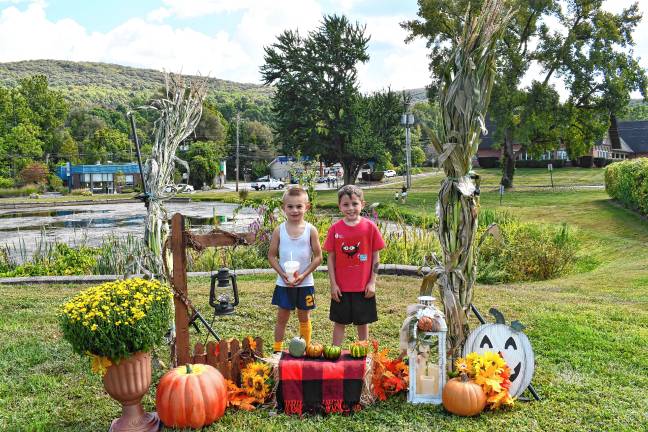 Photos: Vernon Street Fair <b>Dougie Morrica and Conner Minter, both of Vernon, pose with a fall display.</b>